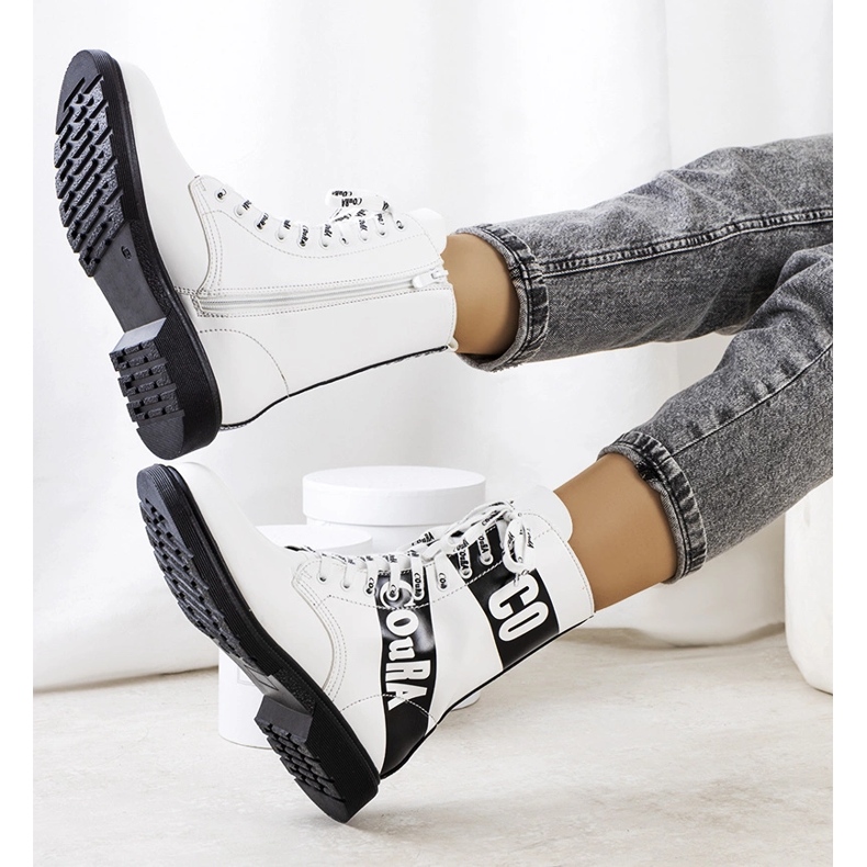 White hiking boots decorated with inscriptions 1