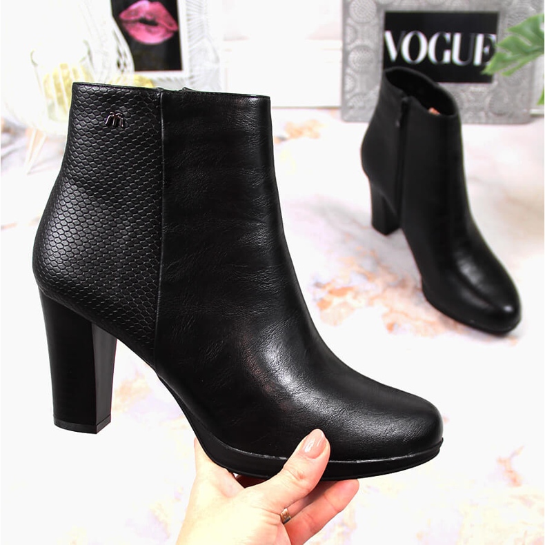 Black insulated women's boots on the post by M. Daszyński 1