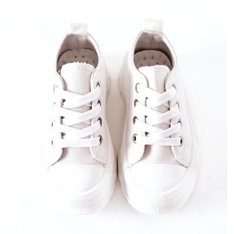 Children's Sneakers On The White Platform 3