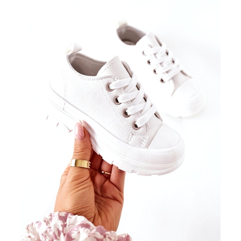 Children's Sneakers On The White Platform 2