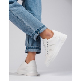 White sports shoes sneakers on the Shelovet platform 2 White sports shoes sneakers on the Shelovet platform 2