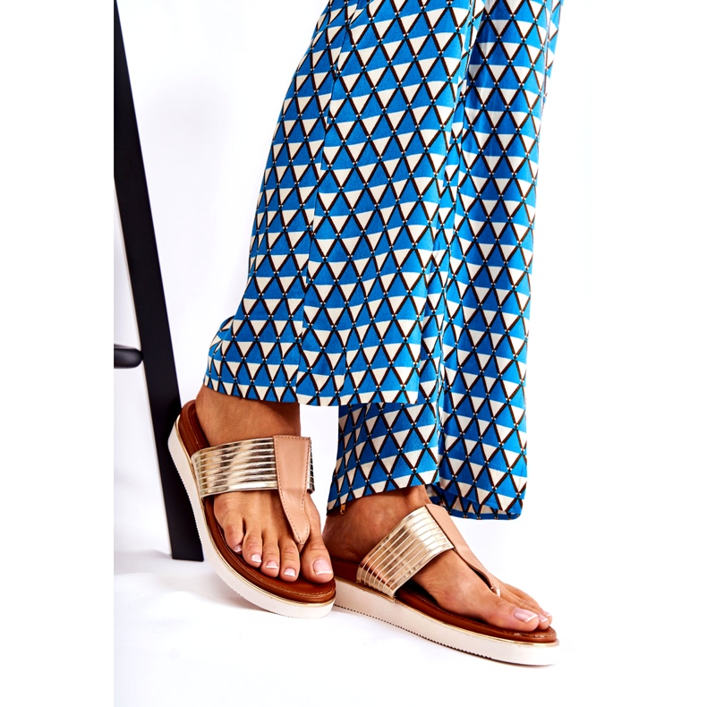 Women's flip-flops on beige-gold platform 1