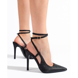 Black pumps on a high heel with crystals from Shelovet 1